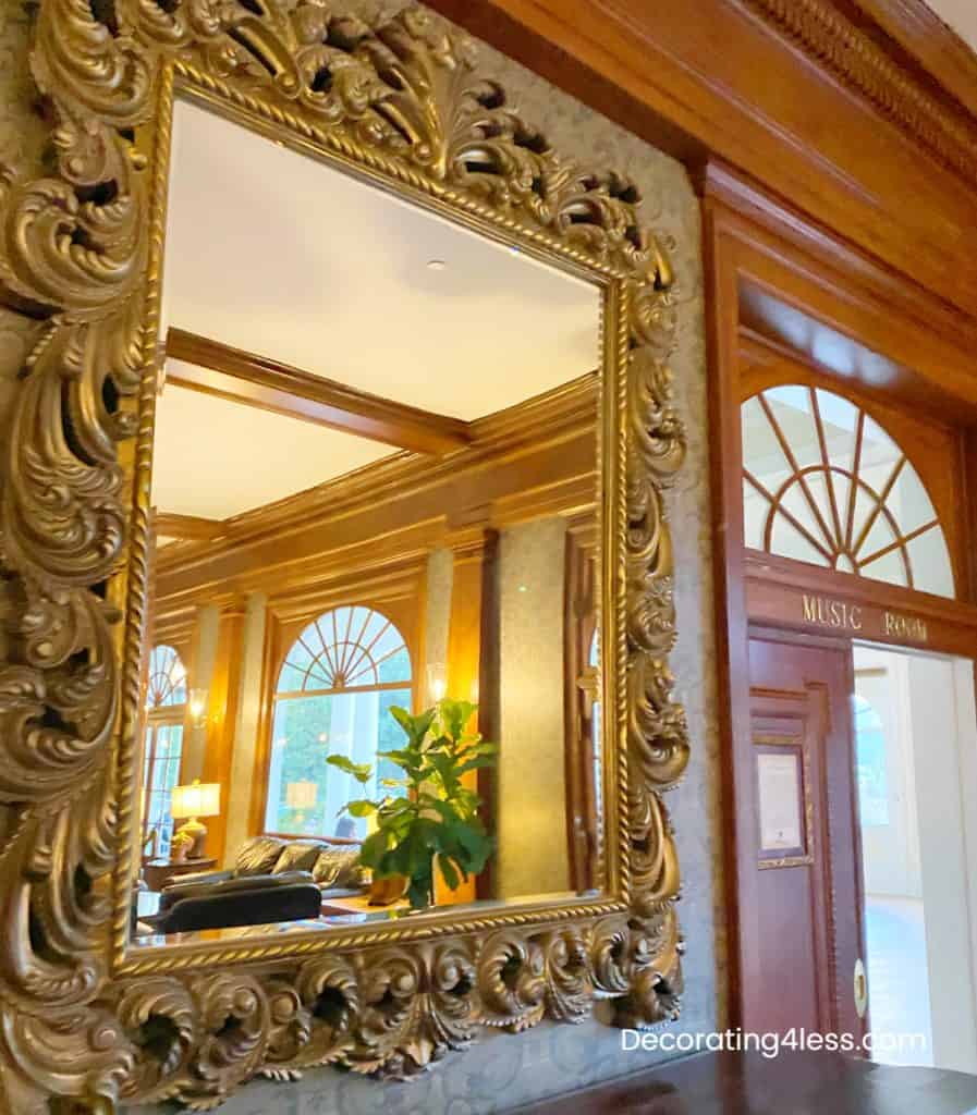 ornate mirror in living room opens up room budget wall art