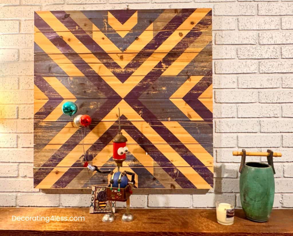 geometric diy wall art using tape to make lines on wall above fireplace